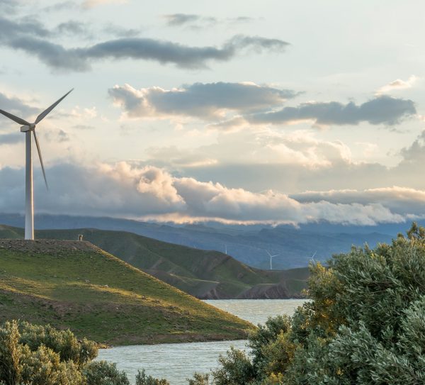 wind-power-turbine-hill-front-cloudy-sky wind-power-turbine-hill-front-cloudy-sky